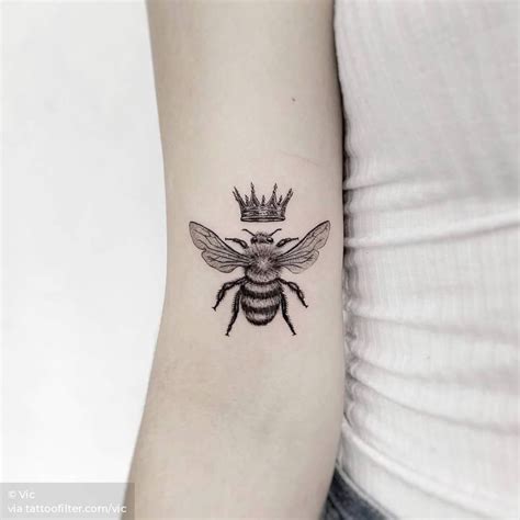 bumble bee with crown tattoo.